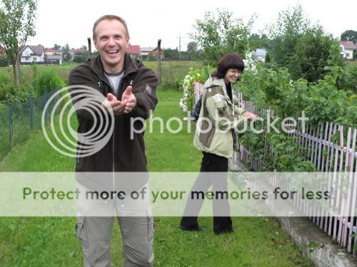 My cousin and his wife in the green lane next to her familys garden plot in Poland.